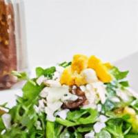 Arugula Salad · Feta cheese, dates, cherry tomatoes, and corn with lemon dressing.