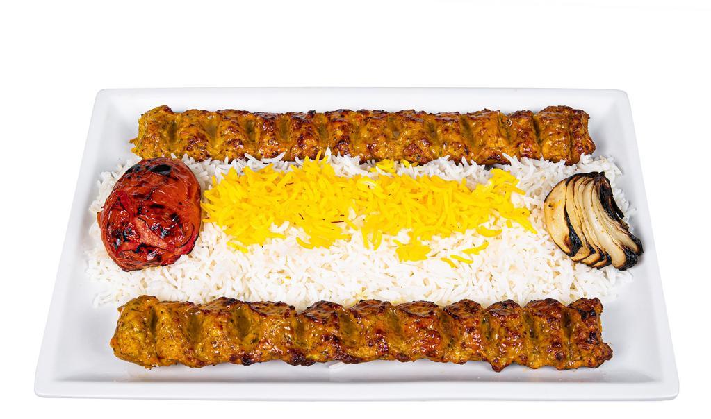 Spicy Ground Chicken Kabob · Two skewers.
Comes with choice of Rice or Salad or Half Rice Half Salad
Includes choice of -  Cucumber Yogurt Sauce or Spicy Yogurt Sauce or Traditional Hummus on the Side
Also Includes Half Pita Bread (4 slices) and Small Lentil Soup
