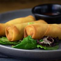 Spring Rolls · Three mixed vegetable spring rolls served with sweet and sour sauce.