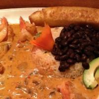 Camarones Envinados · Large butterflied shrimp sauteed with mushrooms, onions in a chipotle Marsala wine sauce, Me...