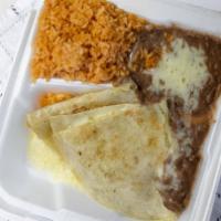 Kids Quesadilla Rice & Beans · Meat with rice and  beans .