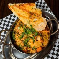 Gumbo · Chicken, shrimp, crab and chicken sausage in a dark roux with French bread.