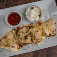 Chicken And Vegetable Quesadilla · Grilled chicken and fresh vegetables in a quesadilla served with  salsa.