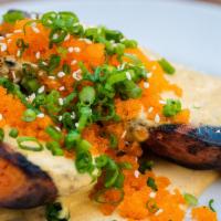 Grilled Sweet Potato · Ginger-honey butter, roasted chile oil, Sichuan sour cream, scallions, Capelin roe