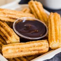 Churro Bites · Spiced churros served with Colombian Dulce de Leche