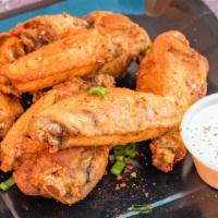 Cajun · 8 traditional wings tossed in Cajun dry rub (mild heat), served with a dipping sauce of your...