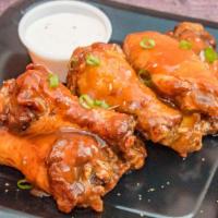 Sweet Chili · 8 traditional wings tossed in sweet chili (mild heat), served with a dipping sauce of your c...
