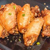 Hot Honey · 8 traditional wings tossed in hot honey (medium heat), served with  a dipping sauce of your ...