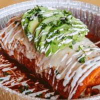 Wet Burrito · Burrito covered in enchilada sauce and melted cheese.