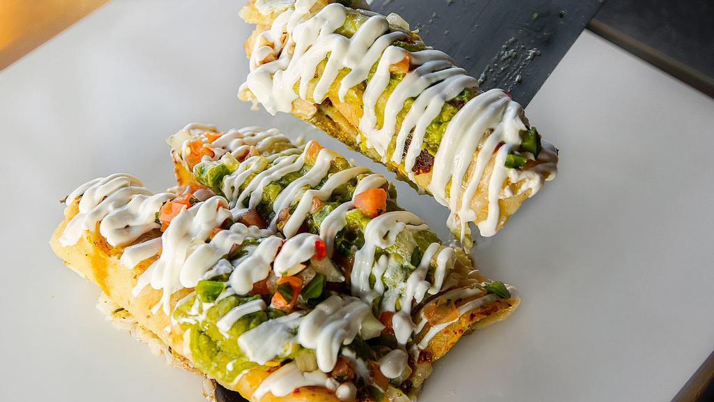 Yellow Bellies · Chicken enchiladas smothered in Chili Verde sauce covered with melted cheese, sour cream, guacamole and pico de gallo. Comes with your choice of rice and beans.