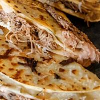 Banditos · Corn tortillas filled with spicy shredded beef and two types of cheese all melted together. ...
