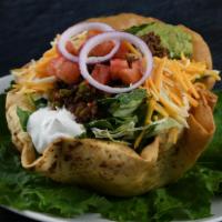 Taco Salad Beef · Sour cream, avocado, Cheddar and Monterrey Jack cheese, black olives, corn, tomatoes, tortil...