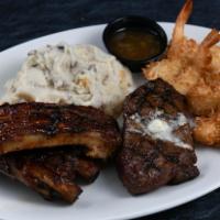 Ribs, Steak & Shrimp Trio · Mojo bone ribs, sirloin steak, Caribbean coconut shrimp, coleslaw, safari fries (8 oz sirloi...