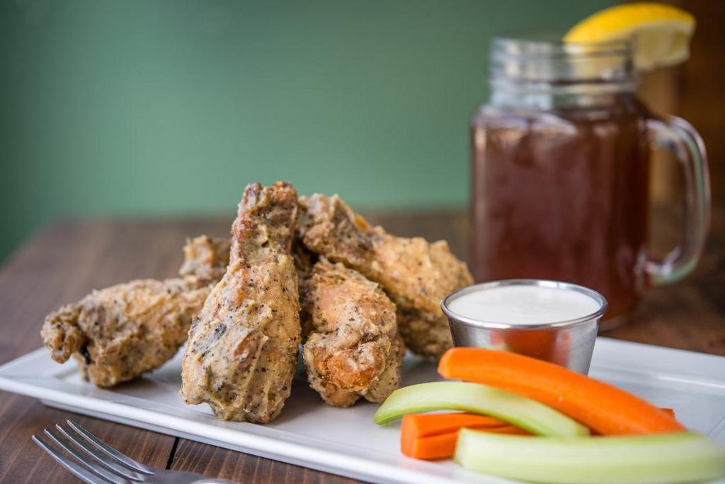 Crispy Wings (Breaded) · Herb seasoned party wings, coated with signature cornmeal crust, served traditionally, or tossed over spicy, mild, bbq, or lemon pepper sauce