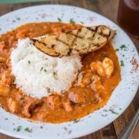 Gretchen'S Jambalaya · Cooked to order with shrimp, andouille sausage, chicken, over pasta or rice