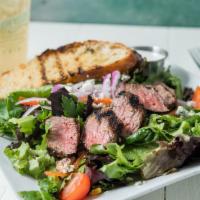 Tri-Tip Salad · Grilled to order Black Angus tri-tip, blue cheese, spring mix, red onions, tomatoes, red pep...