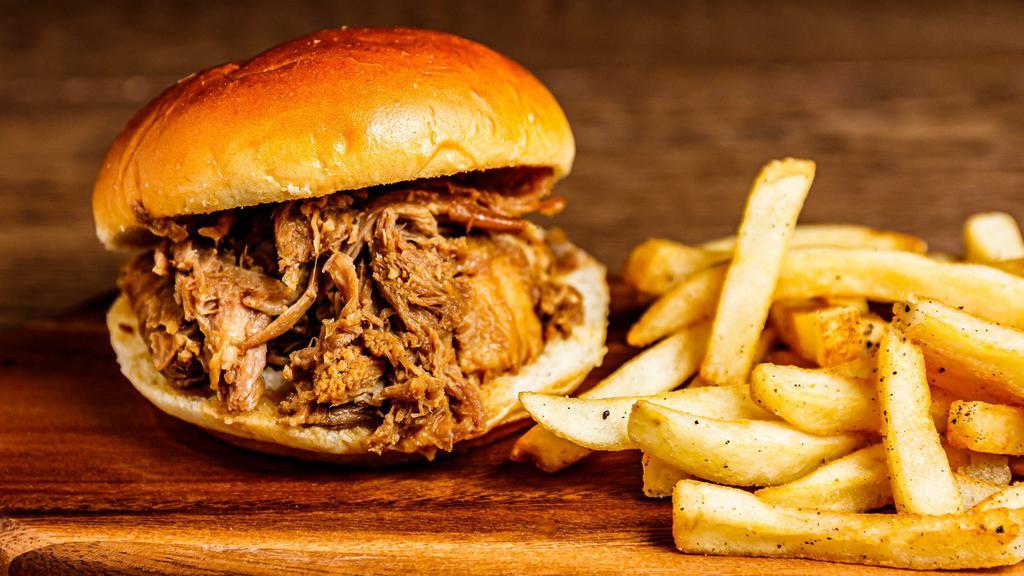 Kalua Pork Sandwich · Hana’s slow roasted pulled pork served on a toasted bun drizzled with teriyaki served with a side of fries.