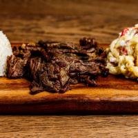 Teriyaki Beef Plate · Thinly sliced Ribeye, marinated in homemade teriyaki and grilled served with a side of white...