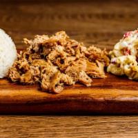 Kalua Pork Plate · Hana’s slow-roasted pork served with a side of white rice and macaroni salad.