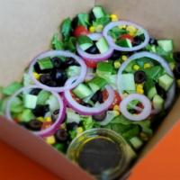 The Burly Salad · Vegan. Gluten Free. 
Chopped romaine, tomato, cucumber, olive, red onion, corn, balsamic dre...