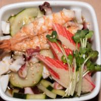 Super Sunomono · Cucumber salad with octopus, shrimp with ponzu sauce.