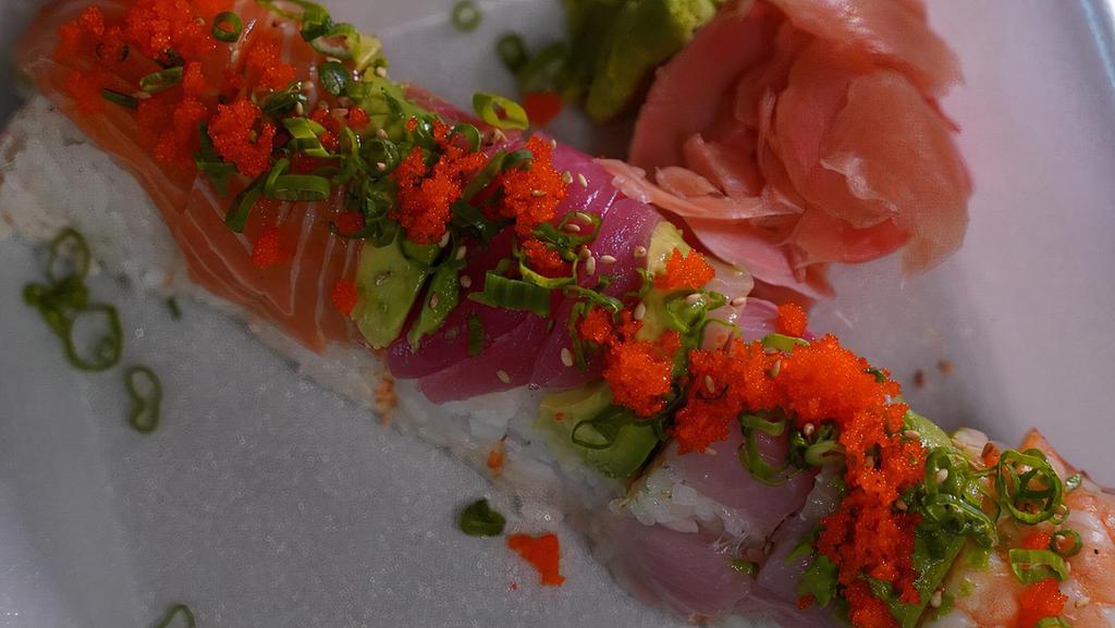 Rainbow Roll · inside: spicy tuna, imitation crab, cucumber - top: tuna, yellowtail, salmon, shrimp & avocado 8pcs