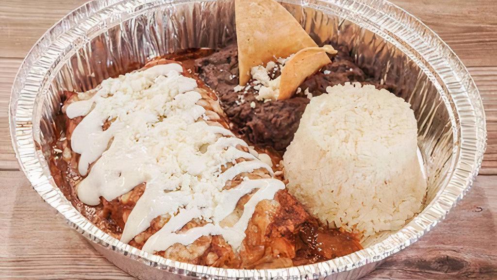 Enchiladas De Chipotle · Two Enchiladas in Our Crazy Good Salsa Chipotle with your choice of Chicken, Cheese, or Shredded Beef. Served with White Rice and Refried Beans.