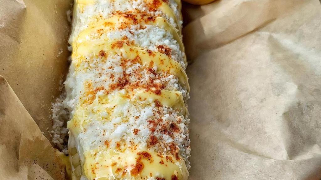 Corn On The Cob / Elote Entero · Mayo, cotija cheese, butter, and chile.