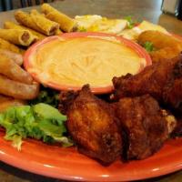 Vientos Sampler · Our appetizer platter featuring hot & spicy buffalo wings, taquitos, cheese quesadillas, jal...