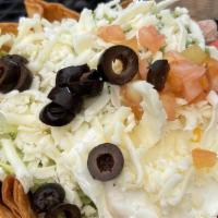 Fiesta Salad · Flour shell filled with beans, choice of meat, lettuce, tomatoes, guacamole, sour cream, che...