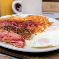 Little Piggy · Two eggs any style, hash browns, two pork bacon strips, two pork sausages, two ham strips & ...