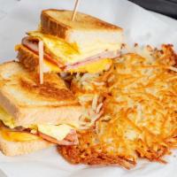 Ham & Egg Melt · Two omelet-style eggs, grilled sliced ham, Swiss & American cheese in grilled sourdough brea...