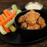 Garlic Parmesan - 8 Wings · 8 boneless wings tossed in garlic Parmesan (mild heat), served with carrots & celery and a d...