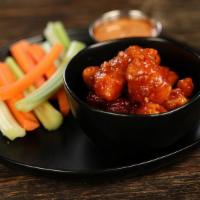 Boneless Sweet Chili · 8 boneless wings tossed in sweet chili (mild heat), served with carrots & celery and a dippi...