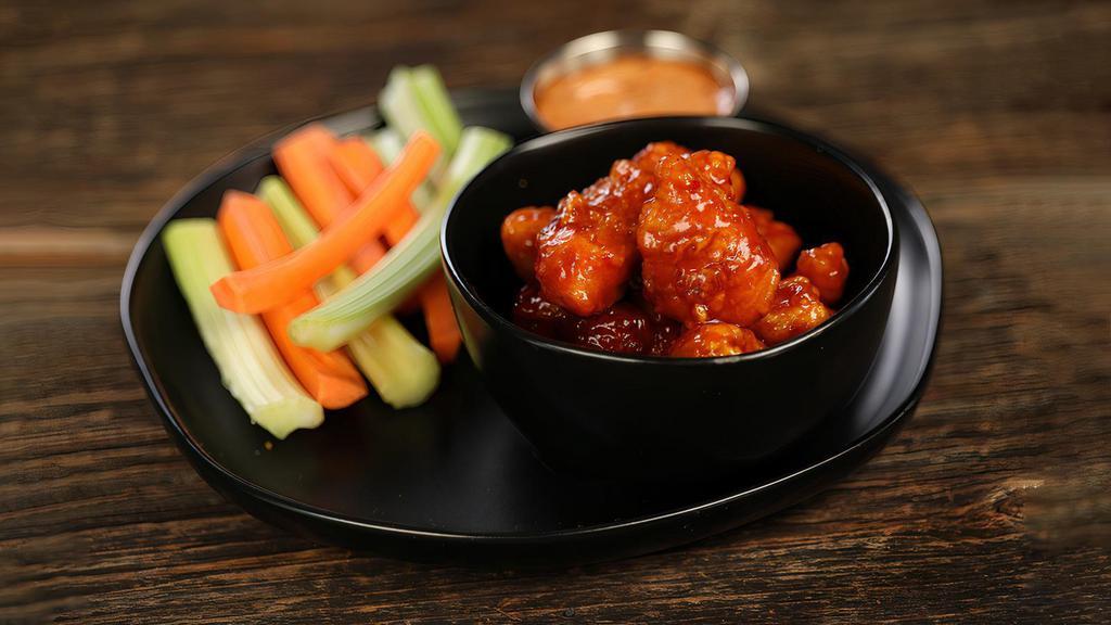 Sweet Chili · 8 boneless wings tossed in sweet chili (mild heat), served with carrots & celery and a dipping sauce of your choice.