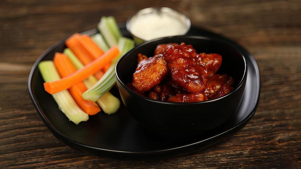 Classic Bbq · 8 boneless wings tossed in BBQ (mild heat), served with carrots & celery and a dipping sauce of your choice.