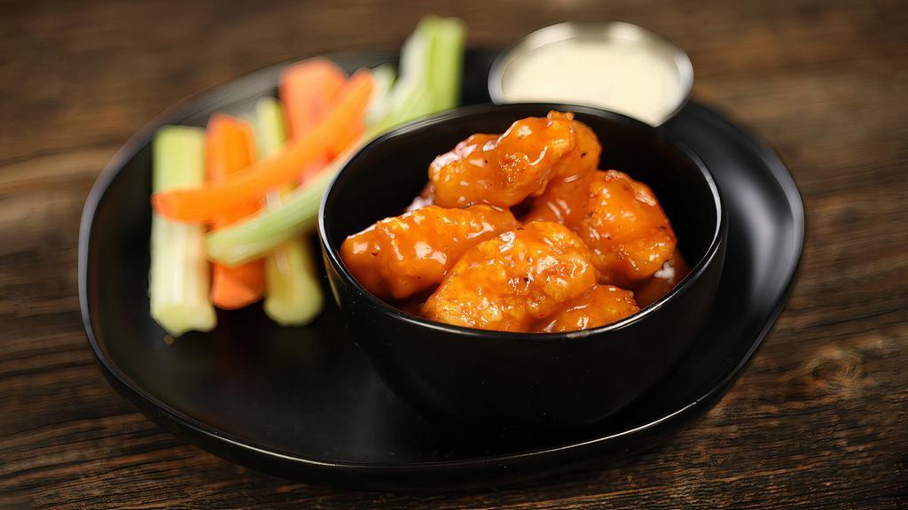 Sriracha Mango · 8 boneless wings tossed in Sriracha mango (medium heat), served with carrots & celery and a dipping sauce of your choice.