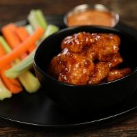 Korean Bbq · 8 boneless wings tossed in Korean BBQ (mild heat), served with carrots & celery and a dippin...