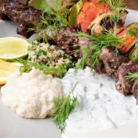 Lamb Shish-Ke-Bob Skewer · nomad kebobs are served with skewered tomatoes, onions & sweet peppers.  . plates include ba...