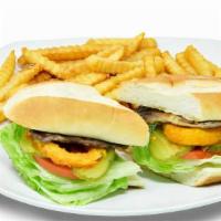 Steak Sandwich Combo · French roll, mayo, lettuce, tomato, pickles and onion rings. French Fries and Medium Soda.
