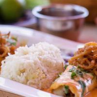 Short Rib Enchiladas · with crispy onions, rice, beans and home-made creamy short rib sauce.