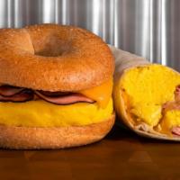 Ham, Egg & Cheese · Ham, egg, and cheese breakfast sandwich or burrito +.50 with cheddar cheese on your choice o...