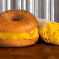 Egg & Cheese · Egg and cheese breakfast sandwich or burrito +1.00 with cheddar cheese, served on your choic...