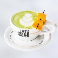 Orange Matcha · Matcha Green Tea Infused with Orange and Topped with Steamed Coconut Milk
