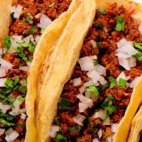 Chorizo Tacos · Two Large Corn Hand made tortillas with a layer of fresh cut potatoes, chorizo, lettuce, que...