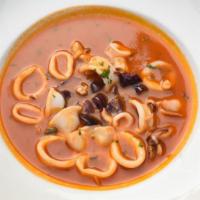 Calamari Posillipo · Select baby squid sautéed with garlic, white wine, black olives, capers and a tomato sauce.