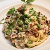 Fettuccine Alla Burino · A delicious combination of pancetta (Italian bacon), peas and mushrooms in a light cream and...