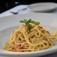 Spaghetti Carbonara · A superb blend of pancetta (Italian bacon), egg, cheese and butter.
