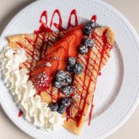 All Strawberry Crepe · Strawberries, strawberry jam, strawberry drizzle, sprinkles, powder sugar and whipped cream.
