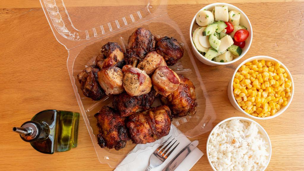 12 Pc. Mixed Chicken: Garlic, Spicy & Chicken W/ Bacon · 4 pieces of our Garlic Chicken legs, 4 pieces of our Spicy Chicken thighs, and 4 pieces of Chicken Breast wrapped in bacon. Slowly grilled over a bed of charcoal and served with your choice of 3 large (16 oz.) sides.